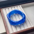 Elegant blue marbled resin bangle bracelet with a curved polished finish for women - Dreamy Deep Blue