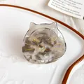 Cute cat-shaped hair claw clip with pearlescent gray marble acetate and gold accents. - Phantom Grey