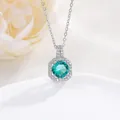 Detail shot of an octagon halo necklace with a round green gemstone and zircon accents - Blue