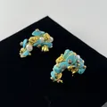 Detailed view of vintage C-shape gold earrings with blue turquoise and white pearls - C-Shaped Turquoise Style (WXE4616C)