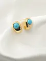 Close-up of gold turquoise stud earrings on white silk fabric with elegant lighting - Curved Turquoise Style (WXE4635Y)