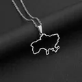 Detailed close-up of a silver Ukraine map pendant necklace on black textured leather - Hollow Map Style (钢色项链C) / Steel