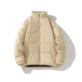 Detail view of unisex beige quilted puffer jacket featuring stand-up collar and zip - Khaki