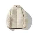 A detailed view of a premium cream unisex winter puffer jacket with stand collar - Off White