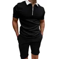 Detailed view of men's slim fit black polo shirt featuring a white zipper collar - Black