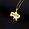 Detailed macro of gold Ukraine map pendant necklace with engraved lettering on black - UKRAINE Lettering Map (金色项链H) / Gold