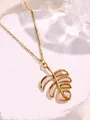Gold monstera leaf pendant necklace with white iridescent shell inlay on stone - Leaf Shape / White