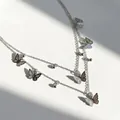 Élégant collier double couche argenté avec breloques papillons et perles délicates - Collier Papillon Double Couche - Argent