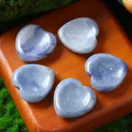 Natural 30mm heart-shaped blue crystal massage stones on rustic wood background - 30MM / Blue Aventurine