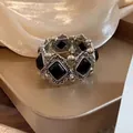 Elegant vintage silver-toned bracelet featuring ornate black rectangular stones jewelry - Silver-Black