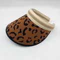 Close-up of leopard print knitted empty top sun visor hat for summer beach wear - Adjustable / Brown
