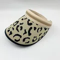 Detailed view of a leopard print knitted sun visor with striped trim. - Adjustable / Khaki