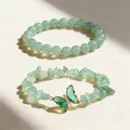 Close-up detail of green natural stone bead bracelet set with crystal butterfly charm - Natural Green Aventurine