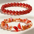 Detail of red agate bracelet set with 8mm round beads and butterfly stone charm. - Natural Red Agate