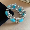 Elegant vintage bohemian stretch bracelet featuring turquoise stones and silver beads - Silver-Blue
