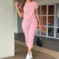 Stylish women's pink casual short-sleeve cargo jumpsuit with drawstring waist and cuffs - S / Pink