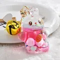 Cute acrylic liquid bunny keychain with pink oil, colorful charms, and a gold bell accessory - Bell Style - Pink