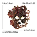 Detailed Venetian carnival mask brooch featuring red enamel and gold leaf accents - Antique Gold Red