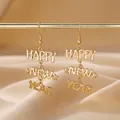 Boucles d'oreilles pendantes dorées Happy New Year pour célébrations festives - Style d'Etoile de Lettre HAPPY NEW YEAR Dorée (14)