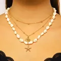 Collana multistrato dorata stile oceano con conchiglie bianche e ciondoli a stella - Stile Stella Marina Conchiglia Bianca a Tre Strati (DZ-933)