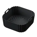 Detailed macro view of a square black silicone air fryer liner with integrated handles. - Square Black