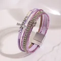 Detail view of Bohemian multi-layer leather bracelet with cross and rhinestone accents - Purple