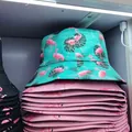 Stylish reversible flamingo print bucket hat in turquoise and pink for summer sun protection - M (56-58cm) / Green Background Flamingo