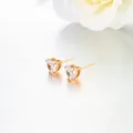 Elegant gold-toned heart-shaped stud earrings with sparkling clear cubic zirconia stones - Ruby Pineapple Studs / Rose Gold