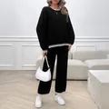 Elegant women's black two-piece knit set featuring long sleeves and white stripe trim details - S / Black