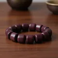 Elegant purple sandalwood barrel bead bracelet handcrafted on a rustic wooden surface - Peltogyne Wood Barrel Beads / 15mm x 14 Pieces / Purplish Brown