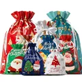 Various colorful Christmas drawstring gift bags featuring festive Santa designs - Colorful Christmas Drawstring Bag Set