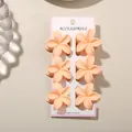 Elegant set of 6 apricot plumeria flower hair claws for women on white display card - 4cm Frangipani Style / 6-Piece Set / Matte Light Orange / Bulk Packaging