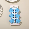 Set of 6 vibrant sky blue frangipani flower hair claw clips on white display card. - 3.5cm Glossy Five-Petal Style / Set of 6 / Bright Blue / Bulk Packaging