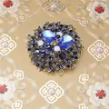 Vintage floral brooch featuring blue rhinestones in a silver-tone metal setting - Vintage Floral Cluster (XH-1875) / Blue