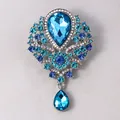 Elegant ornate floral brooch with sparkling blue rhinestones and teardrop pendant - Teardrop Flower (XH-1398) / Blue