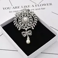 Vintage silver rhinestone flower wreath brooch with elegant pearl drop and bow design - Vintage Peacock Floral Style (XH-1861)