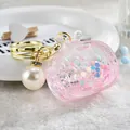 Cute pink TV-shaped oil-filled keychain featuring a large pearl and glitter stars - Noctilucent TV Style / Pink