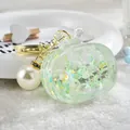 Transparent TV-shaped liquid keychain with large pearl charm and glitter stars - Noctilucent TV Style / Green