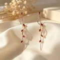 Elegant French luxury long earrings with red leaf marquise stones and gold twisted fringe - Gold-Red Zirconia