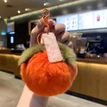Detailed macro view of the soft orange plush persimmon keychain texture - Persimmon Smooth Exam