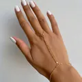Dainty gold hand chain finger bracelet with elegant vintage links on model hand - Sequin Style (Bracelet #605) / Gold