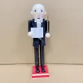 Detailed view of a 38cm wooden conductor nutcracker ornament wearing a black tuxedo - Bald Professor