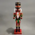 Traditional 38cm African American wooden nutcracker drummer with green glitter jacket - African Drummer