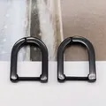 Macro detail of glossy black U-shaped titanium steel non-pierced hoop ear clips - Large U-shape Black (Single Piece)
