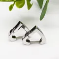 Detailed view of heart-shaped titanium steel hoop earrings with polished silver finish - Heart Shape Steel Color (Single Piece)