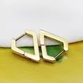 Close-up of geometric gold-plated triangle hoop earrings in polished titanium steel. - Diamond Shape Gold (Single Piece)