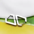 Macro view of geometric titanium steel hoop earrings with a polished silver finish - Diamond Shape Steel Color (Single Piece)
