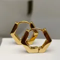 Close-up of elegant gold-plated hexagonal hoop earrings with smooth polished finish - Hexagon Gold (Single Piece)
