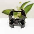Close-up of black titanium steel huggie earrings with a minimalist polygon design - Small U-shape Black (Single Piece)