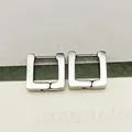 Close-up of polished silver square hoop earrings with secure hinge closure - Square Steel Color (Single Piece)